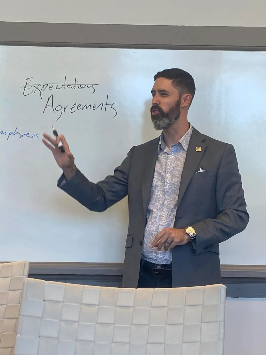 Justin Kier at a whiteboard, the words Expectations and Agreements written beside him